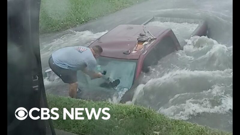テキサス州のカップルが浸水した溝からトラック運転手を救出するドラマチックな瞬間